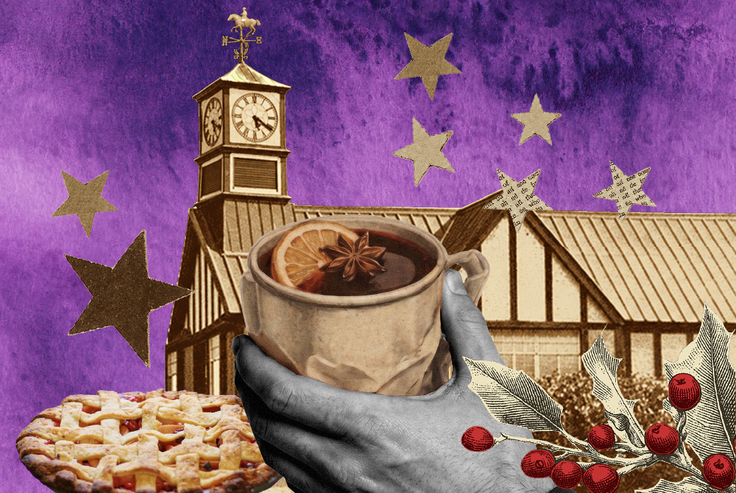 A cup of mulled wine held in front of the market huts and the clock tower